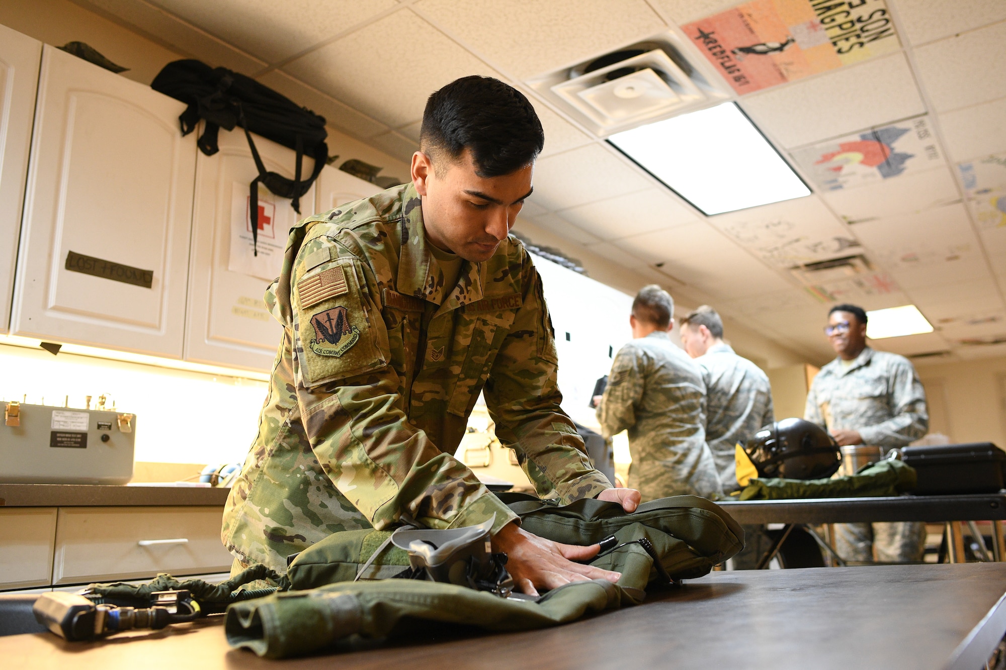 388th Operations Support Squadron Aircrew Flight Equipment shop, works on flight equipment, Nellis Air Force Base, Nevada, Feb. 5, 2019. AFE Airmen manage, check and prepare gear pilots need to fly and also survive in the event of an emergency. (U.S. Air Force photo by R. Nial Bradshaw)