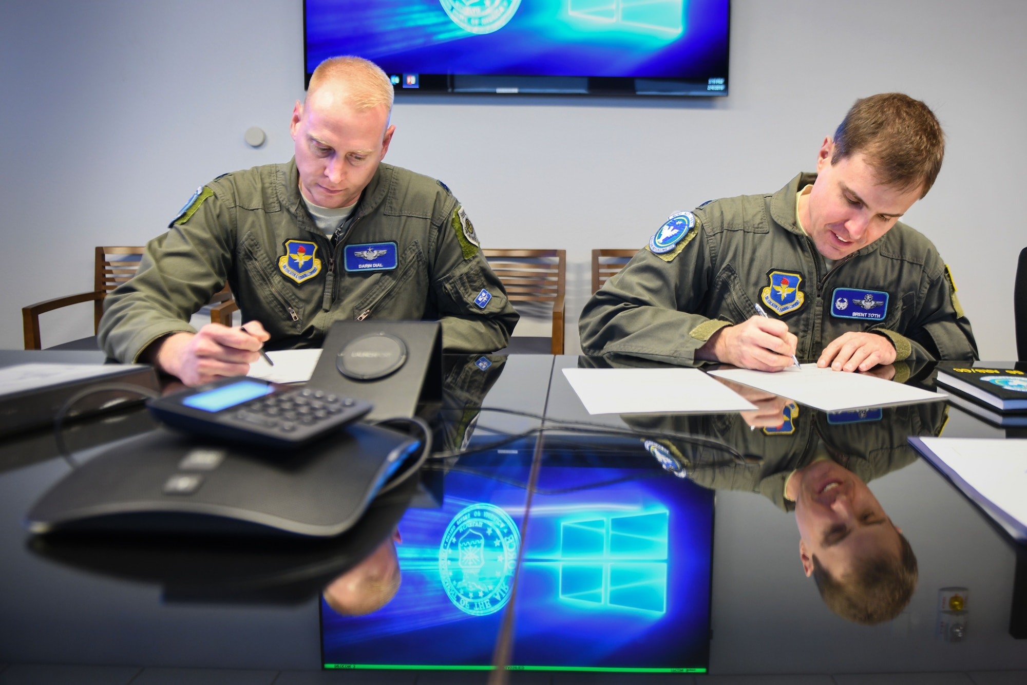 U.S. Air Force Lt. Col. Darin Dial, 56th Air Refueling Squadron director of operations, and Lt. Col. Brent Toth, 56th ARS commander, sign the first set of flight orders for the incoming KC-46A Pegasus, Feb. 4, 2019, at Altus Air Force Base, Okla. The 56th ARS will conduct training for the pilots and boom operators of the KC-46. (U.S. Air Force photo by Airman 1st Class Jeremy Wentworth)