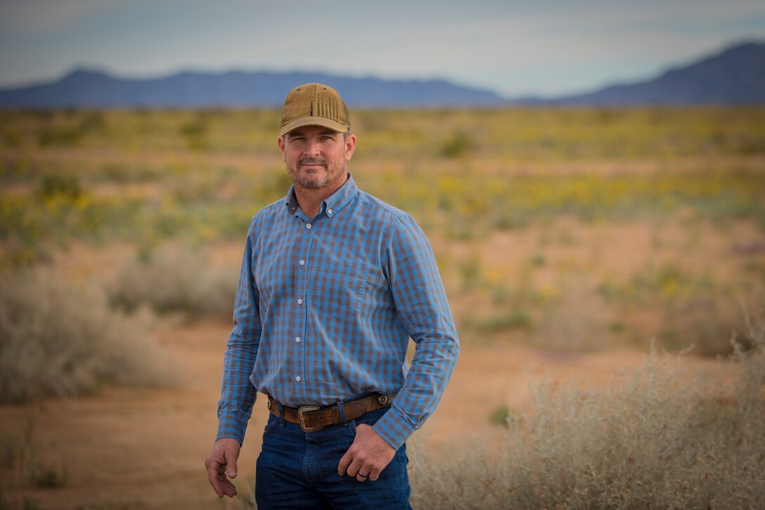 Personnel with the Conservation, Natural Resource section of Range Management, Marine Corps Air Station (MCAS) Yuma, pose for portrait photographs on ranges owned by MCAS Yuma, Jan. 17, 2019. The Conservation staff is responsible for all areas of wildlife management and recreation on all 1.2 million acreas of MCAS Yuma ranges. (U.S. Marine Corps photo by Sgt. Allison Lotz)