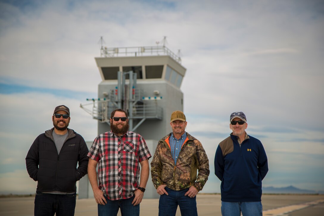 Personnel with the Conservation, Natural Resource section of Range Management, Marine Corps Air Station (MCAS) Yuma, pose for portrait photographs on ranges owned by MCAS Yuma, Jan. 17, 2019. The Conservation staff is responsible for all areas of wildlife management and recreation on all 1.2 million acreas of MCAS Yuma ranges. (U.S. Marine Corps photo by Sgt. Allison Lotz)