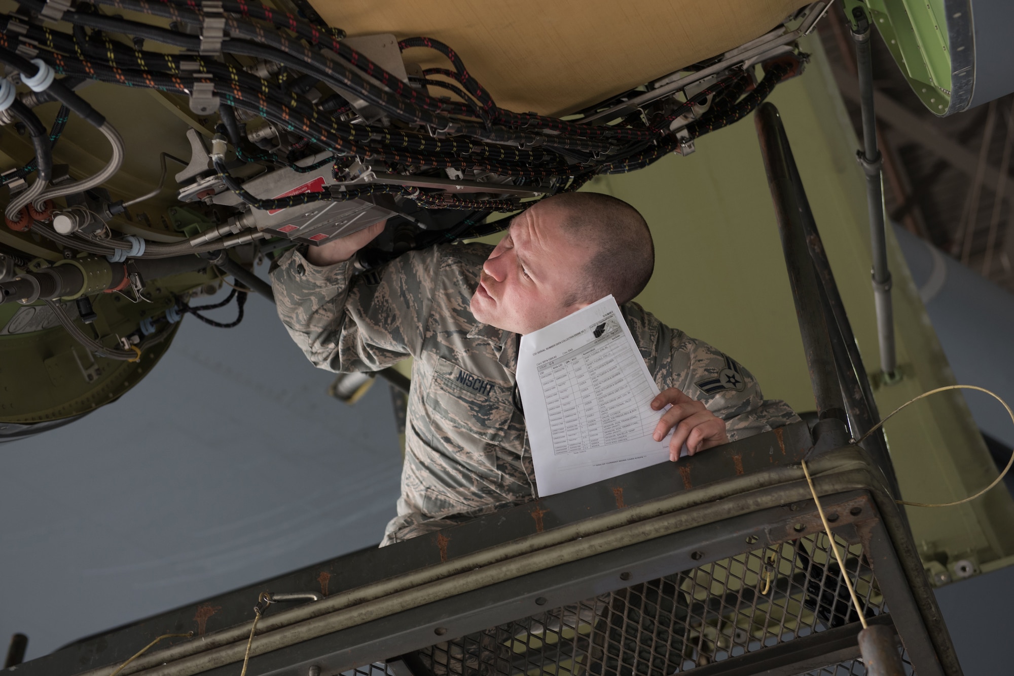 U.S. Air Force Airman 1st Class Kyle Nischt, 60th Aircraft Maintenance Squadron aerospace propulsion journeyman, inspects a C-5M Super Galaxy Jan. 28, 2019 at Travis Air Force Base, Calif. Regular maintenance ensures the C-5 is mission ready and the 60th Maintenance Group's Maintenance Operations Center coordinates all maintenance actions at Travis. (U.S. Air Force photo by Tech. Sgt. James Hodgman)