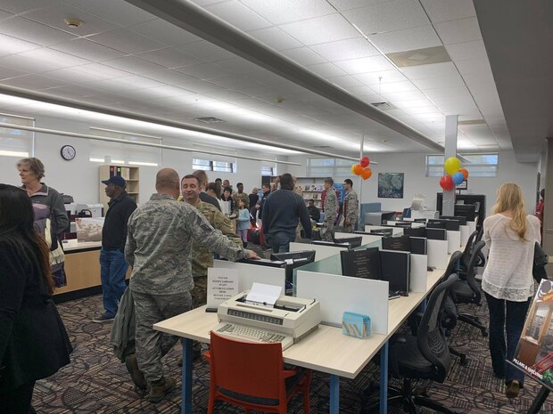Patrons and employees of the Joint Base Charleston Air Base Library enjoy a tour of the newly renovated library as well as snacks and social time. The just reopened Air Base Library has been upgraded with new carpet, paint and furniture and will be more flexible not only for readers, but for events to be held at the facility. The renovation was part of an Air Force initiative  to modernize base libraries.