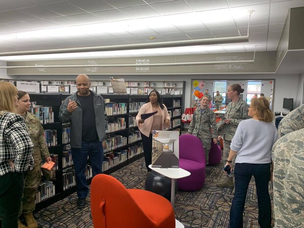 Patrons and employees of the Joint Base Charleston Air Base Library enjoy a tour of the newly renovated library as well as snacks and social time. The just reopened Air Base Library has been upgraded with new carpet, paint and furniture and will be more flexible not only for readers, but for events to be held at the facility. The renovation was part of an Air Force initiative  to modernize base libraries.