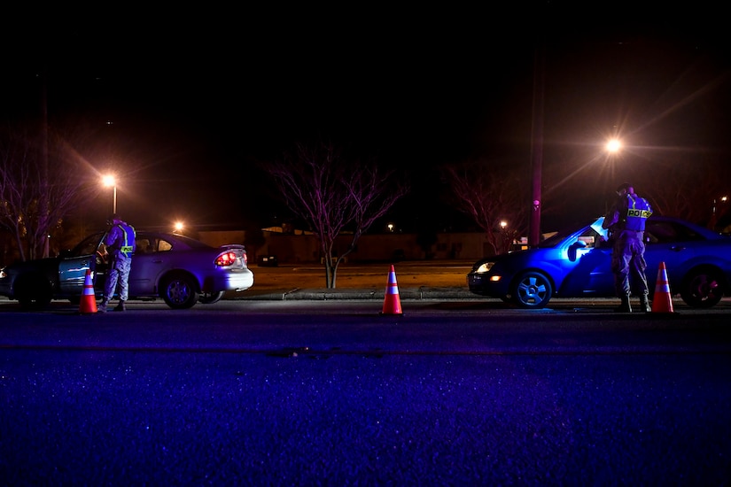 628th Security Forces Squadron patrolmen check drivers’ insurance and registration during a DUI checkpoint Feb. 3, 2019, at Joint Base Charleston, S.C.