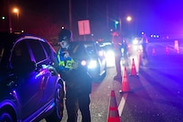 628th Security Forces Squadron patrolmen check drivers’ insurance and registration during a DUI checkpoint Feb. 3, 2019, at Joint Base Charleston, S.C.