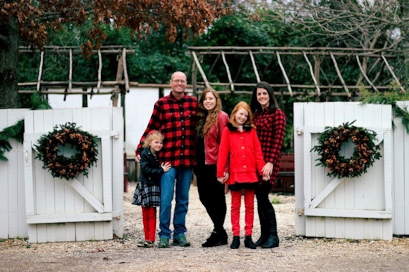 U.S. Air Force Tech. Sgt. Jason Kelley, 633rd CES NCO in charge of pavements and equipment, his wife Carrie Kelley, and daughters Annabelle, Madelyn, and Emily pose for a family photo.