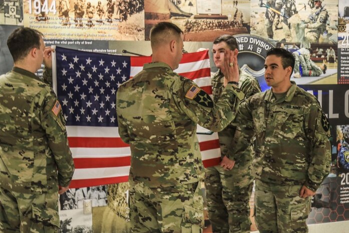 Reenlistment Unites Two Generations of Army