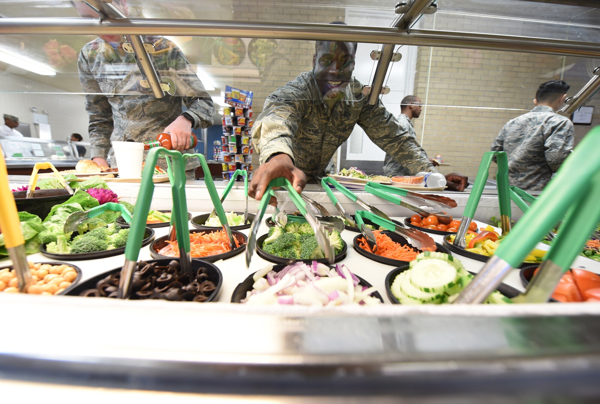 Airman making a salad
