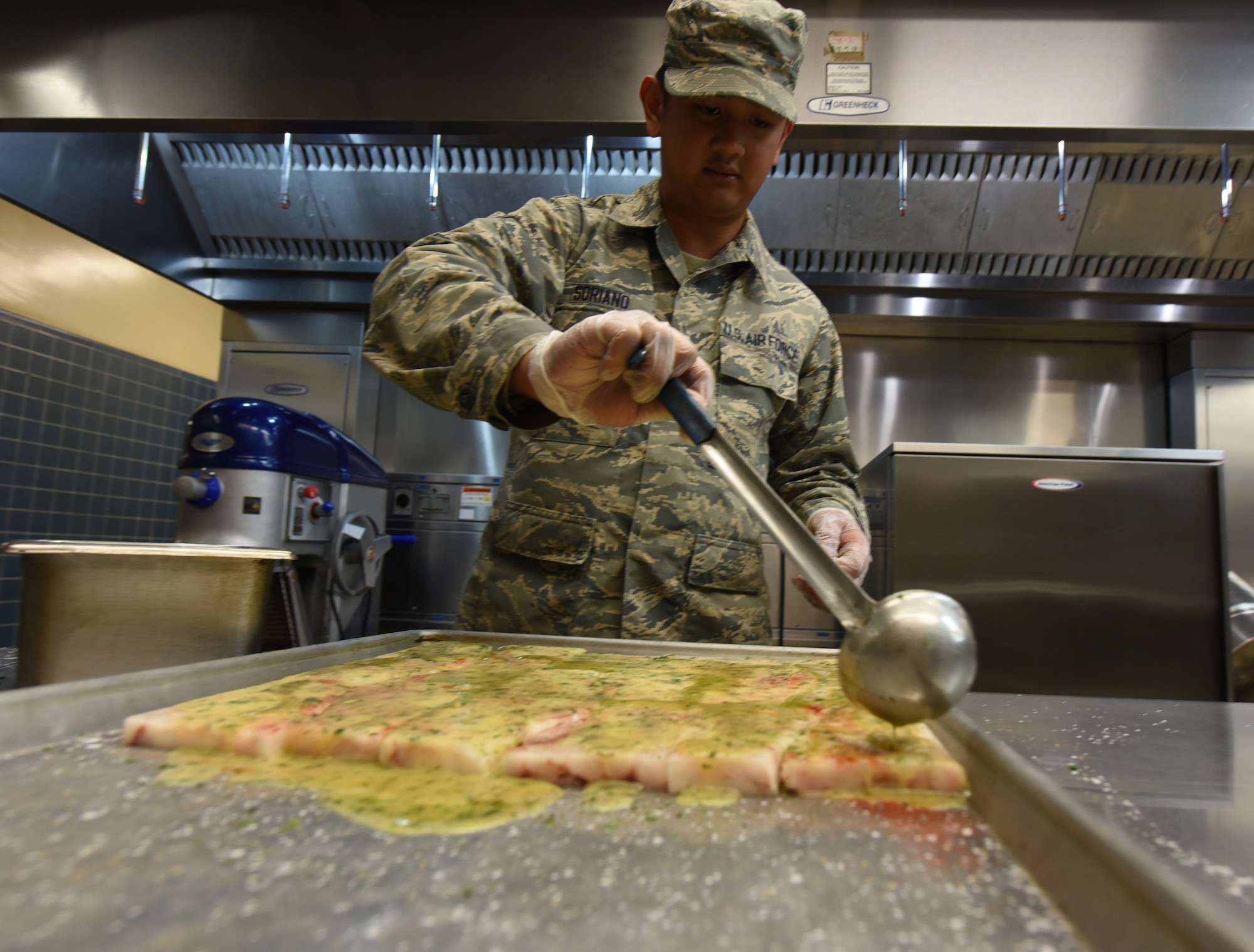 Airman preparing food