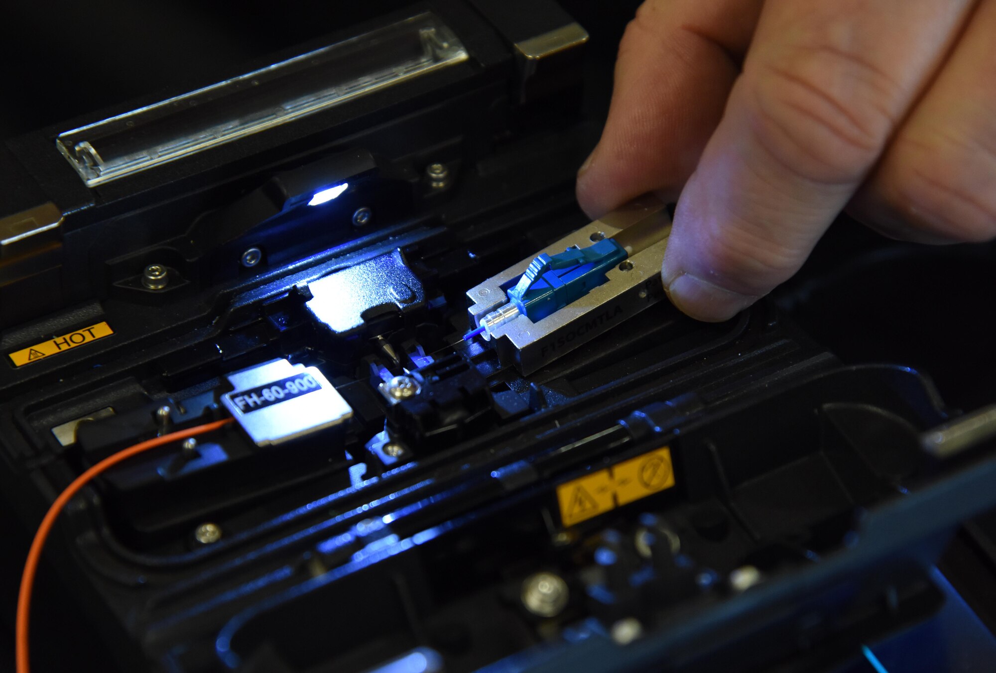 John DeMetro, Fiber Instrument Sales Inc. sales associate, demonstrates how to use an AC4 fusion splicer during the Annual Keesler Air Force Base Tech Expo inside the Bay Breeze Event Center at Keesler Air Force Base, Mississippi, Feb. 5, 2019. The expo was hosted by the 81st Communications Squadron and was free to all Defense Department, government and contractor personnel with base access. U.S. Air Force Maj. Jon Drummond, 81st Communictions Squadron commander, said events like this allows us to see the local vendors' newest technologies and find opportunities to branch that technology with Keesler's training mission. The event was held to introduce military members to the latest in technological advancements to bolster the Air Force's capabilities in national defense. (U.S. Air Force photo by Kemberly Groue)