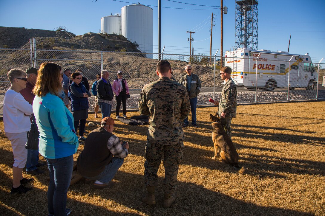 Guests participating in the Marine Corps Air Station (MCAS) Yuma Winter Tours observe a demonstration of the obstacle course, the Marine Corps Martial Arts Program (MCMAP), and a military working dog demonstration at various locations on MCAS Yuma, Ariz., Jan.9, 2019. Col. David A. Suggs, the station commanding officer, resumed the tours in 2018 to strengthen the relationship with the outside community and give them the opportunity to see what the Marines aboard the air station do. (U.S. Marine Corps photo taken by Cpl. Isaac D. Martinez)