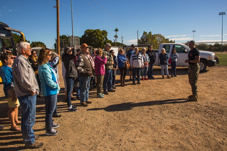 Guests participating in the Marine Corps Air Station (MCAS) Yuma Winter Tours observe a demonstration of the obstacle course, the Marine Corps Martial Arts Program (MCMAP), and a military working dog demonstration at various locations on MCAS Yuma, Ariz., Jan.9, 2019. Col. David A. Suggs, the station commanding officer, resumed the tours in 2018 to strengthen the relationship with the outside community and give them the opportunity to see what the Marines aboard the air station do. (U.S. Marine Corps photo taken by Cpl. Isaac D. Martinez)
