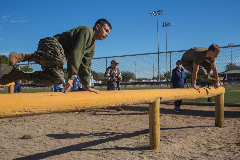 Guests participating in the Marine Corps Air Station (MCAS) Yuma Winter Tours observe a demonstration of the obstacle course, the Marine Corps Martial Arts Program (MCMAP), and a military working dog demonstration at various locations on MCAS Yuma, Ariz., Jan.9, 2019. Col. David A. Suggs, the station commanding officer, resumed the tours in 2018 to strengthen the relationship with the outside community and give them the opportunity to see what the Marines aboard the air station do. (U.S. Marine Corps photo taken by Cpl. Isaac D. Martinez)