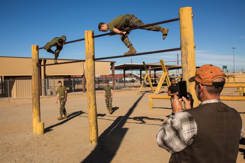 Guests participating in the Marine Corps Air Station (MCAS) Yuma Winter Tours observe a demonstration of the obstacle course, the Marine Corps Martial Arts Program (MCMAP), and a military working dog demonstration at various locations on MCAS Yuma, Ariz., Jan.9, 2019. Col. David A. Suggs, the station commanding officer, resumed the tours in 2018 to strengthen the relationship with the outside community and give them the opportunity to see what the Marines aboard the air station do. (U.S. Marine Corps photo taken by Cpl. Isaac D. Martinez)