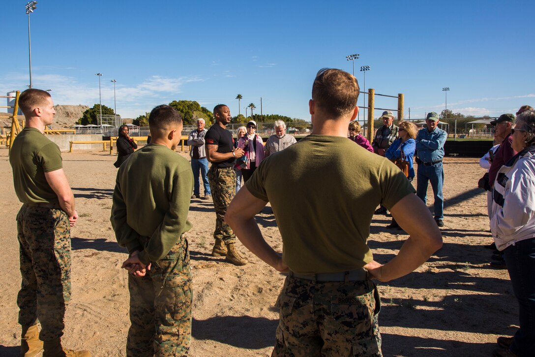 Guests participating in the Marine Corps Air Station (MCAS) Yuma Winter Tours observe a demonstration of the obstacle course, the Marine Corps Martial Arts Program (MCMAP), and a military working dog demonstration at various locations on MCAS Yuma, Ariz., Jan.9, 2019. Col. David A. Suggs, the station commanding officer, resumed the tours in 2018 to strengthen the relationship with the outside community and give them the opportunity to see what the Marines aboard the air station do. (U.S. Marine Corps photo taken by Cpl. Isaac D. Martinez)