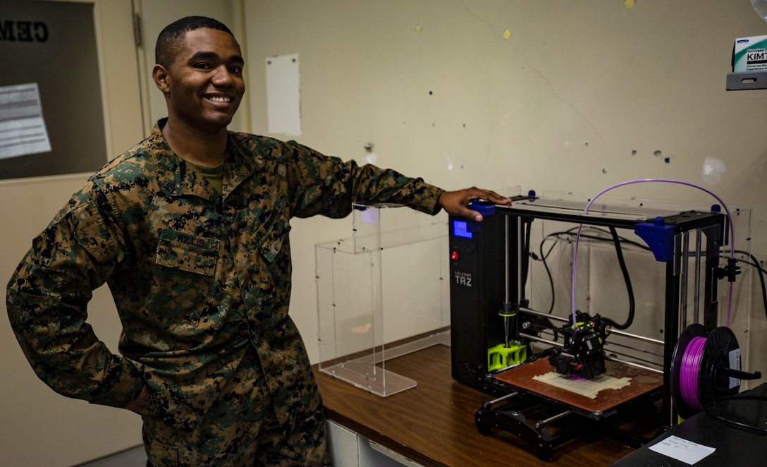 U.S. Marine Corps Sgt. Adrian J. Willis, a computer technician with 7th Communications Battalion, pictured here aboard Marine Corps Base Camp Hansen in Okinawa, Japan, is one of the Marines that utilize 3D printing technology to expand capabilities within the unit.