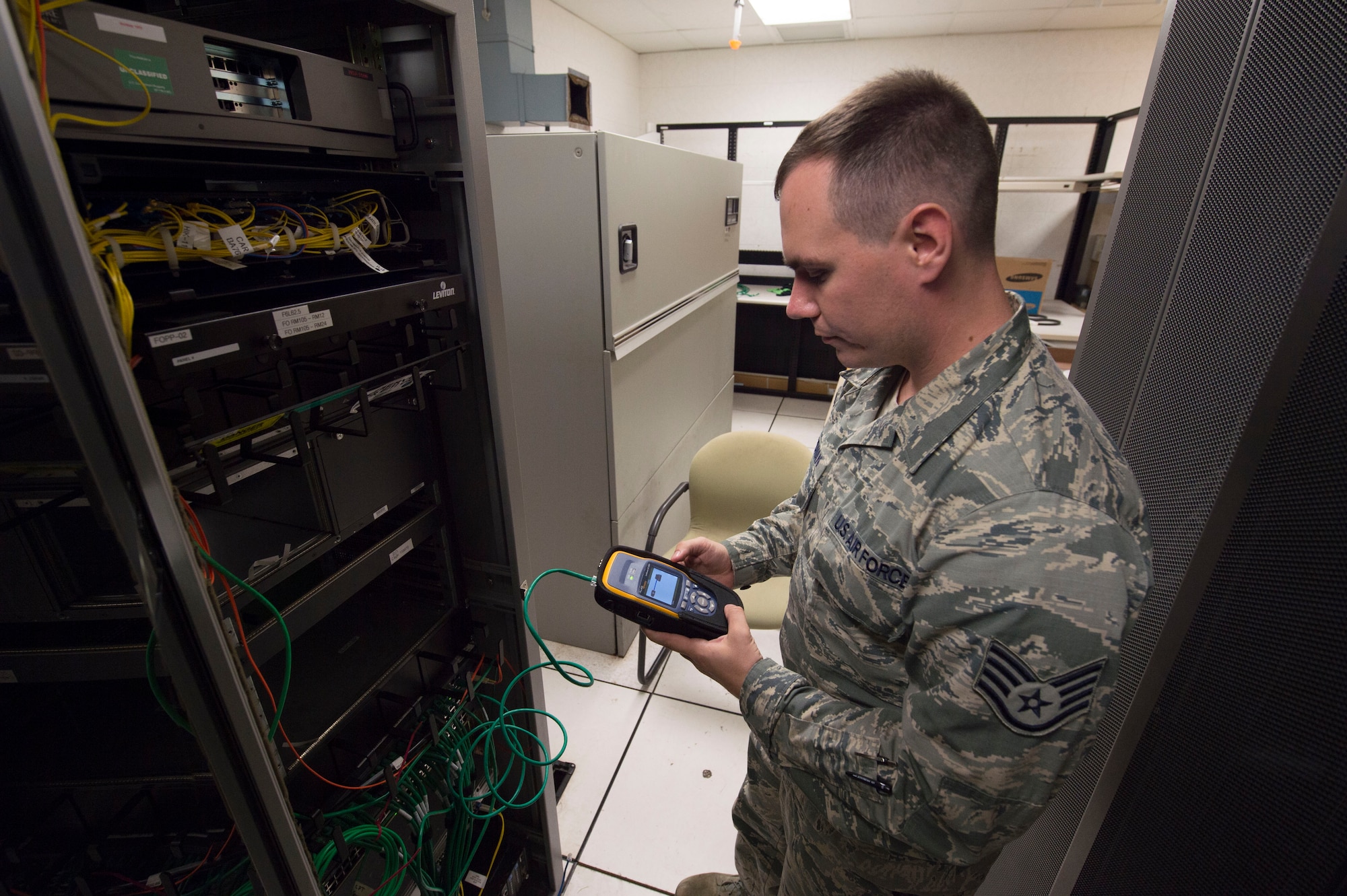 Staff Sgt. Daniel McGowan, 747th Communications Squadron network infrastructure specialist, tests a port network connection on Joint Base Pearl Harbor-Hickam, Hawaii, Feb. 6, 2019. The 747th CS, maintains the NIPR and SIPR networks for the 15th Wing, allowing Airmen to execute their missions across the Indo-Pacific region. (U.S. Air Force photo by Tech. Sgt. Heather Redman)