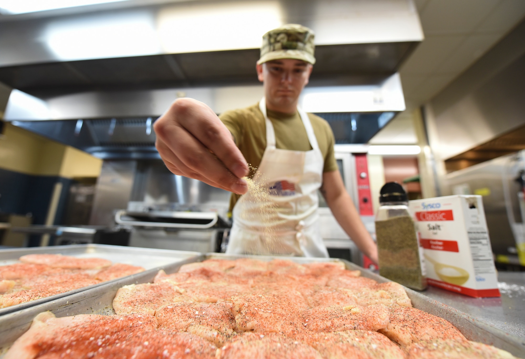 Airman preparing food