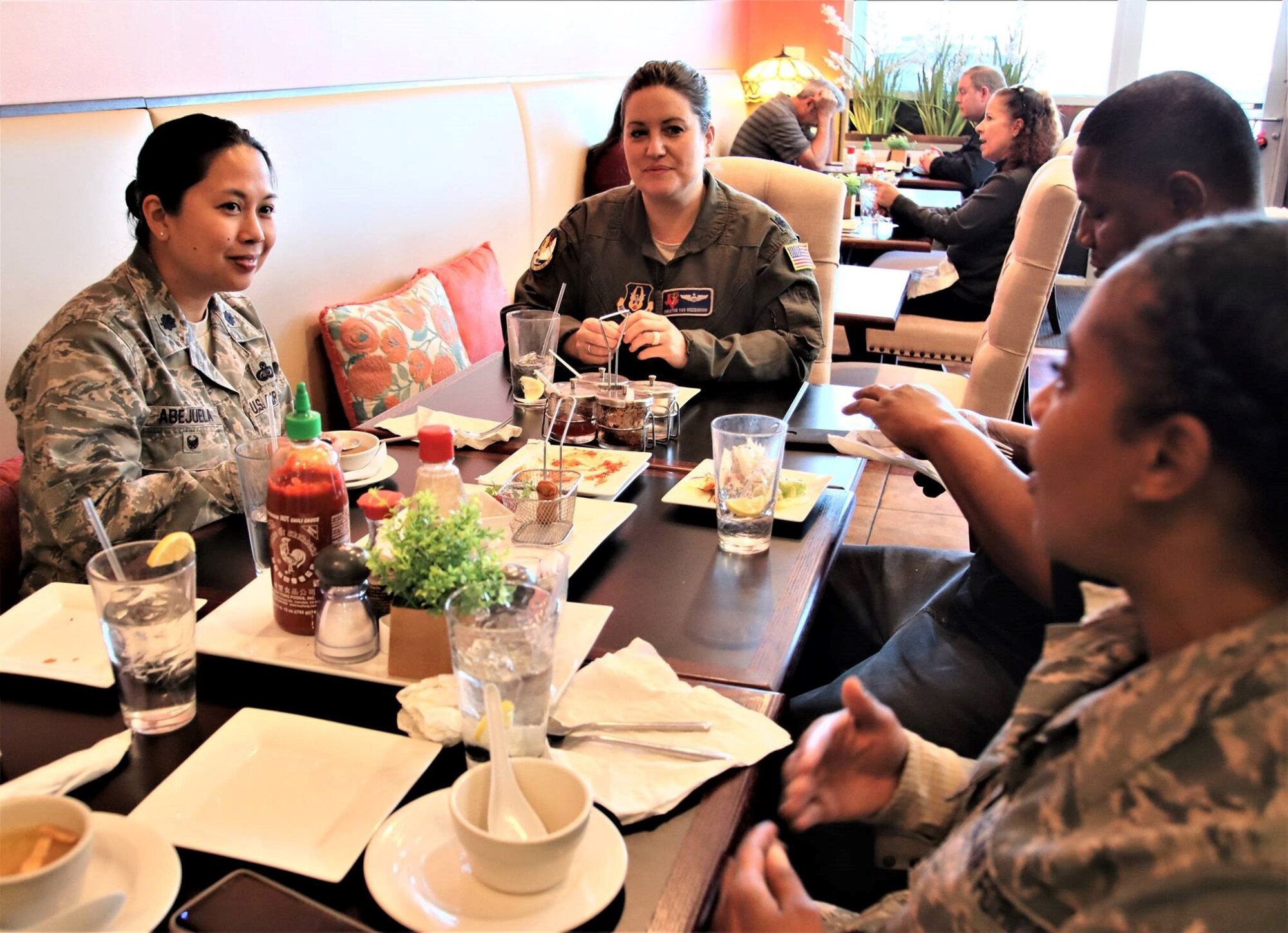 Lt. Col. Myla Abejuela (left), 340th FTG inspector general for the last two and a half years, chats with group members Jan. 23 during one of several lunch gatherings held to say goodbye and wish her well in her new job as individual mobilization augmentee to the 436th Force Support Squadron commander, Dover, AFB. The move was a bit of a homecoming for Abejuela whose last active duty unit was at the 436th. (U.S. Air Force photo by Janis El Shabazz)