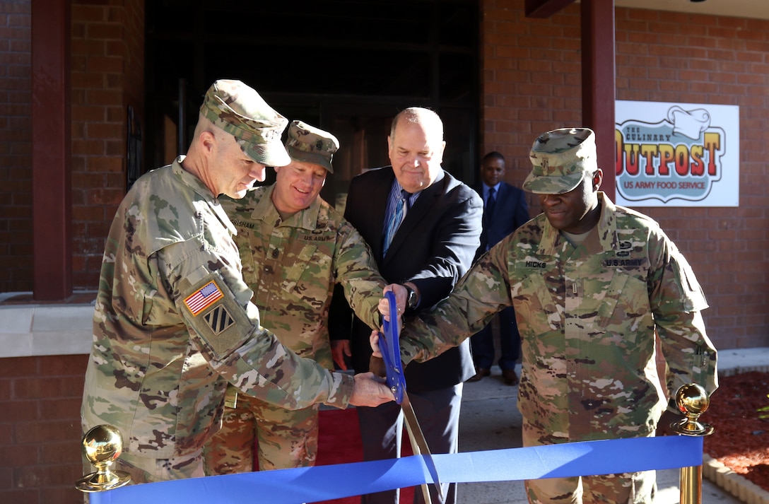From left, Col. Jeffrey Britton, the 3rd Infantry Division Sustainment Brigade commander, Command Sgt. Maj. Toby Grisham, the senior enlisted advisor for 3rd Inf. Div. Sust. Bde., David Staples, the director of operations for the Army Center of Excellence, Subsistence, and Chief Warrant Officer 5 Kenneth Hicks, the Army food advisor for the Sustainment Center of Excellence, cut the ribbon during the grand opening of the Culinary Outpost Kiosk, Feb. 4, 2019 at Ft. Stewart, Ga. The food kiosk, first of its kind for DLA and the Army, symbolizes the innovation and modernization efforts of the Army’s food program. (U.S. Army photo by Sgt. Elizabeth White/Released)