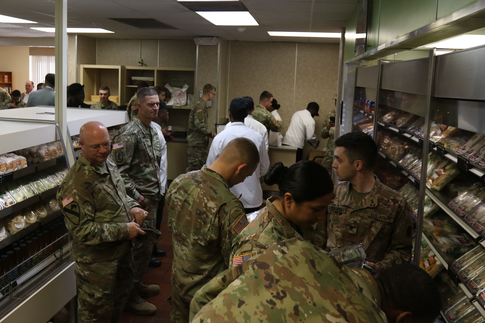 Soldiers with the 3rd Infantry Division shop at the Culinary Outpost Kiosk, Feb. 4, 2019 at Ft. Stewart, Ga. The food kiosk, first of its kind for the DLA and the Army, symbolizes the innovation and modernization efforts of the Army’s food program. (U.S. Army photo by Sgt. Elizabeth White/Released)