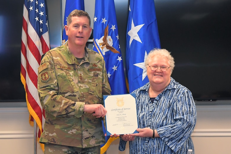 Nola K. Sharp, 523rd Electronic Maintenance Squadron, receives a 40-year certificate of service from Lt. Gen Gene Kirkland, Air Force Sustainment Center commander, Feb. 4, 2019, at Hill Air Force Base, Utah. (U.S. Air Force photo by Todd Cromar)