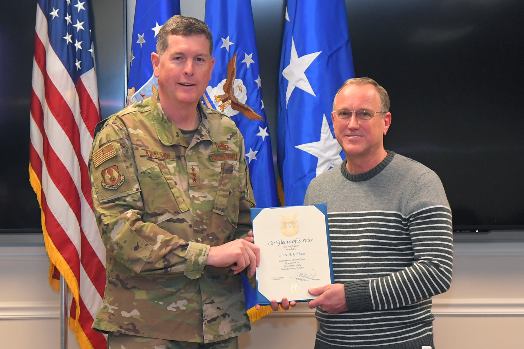 Bruce A. Gorham, 532nd Commodities Maintenance Squadron, receives a 40-year certificate of service from Lt. Gen Gene Kirkland, Air Force Sustainment Center commander, Feb. 4, 2019, at Hill Air Force Base, Utah. (U.S. Air Force photo by Todd Cromar)