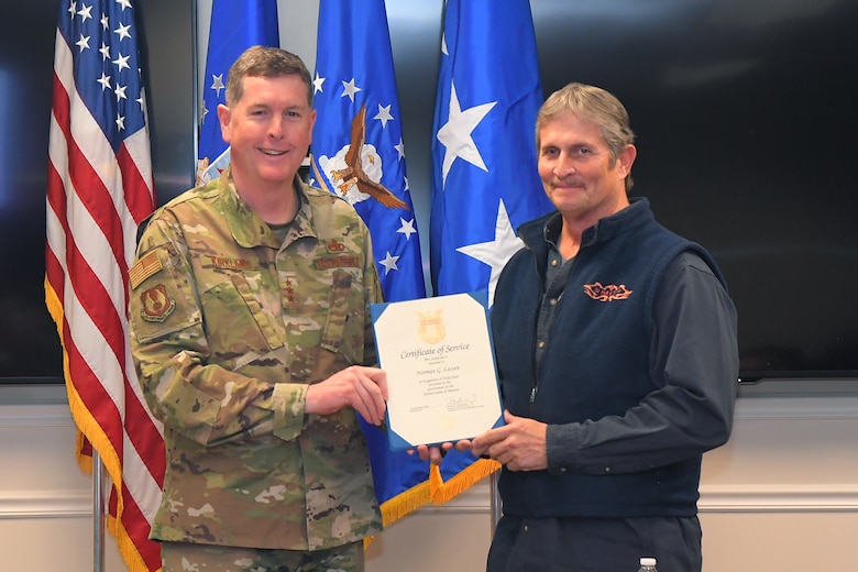 Norman G. Lassen, 581st Missile Maintenance Squadron, receives a 40-year certificate of service from Lt. Gen Gene Kirkland, Air Force Sustainment Center commander, Feb. 4, 2019, at Hill Air Force Base, Utah. (U.S. Air Force photo by Todd Cromar)