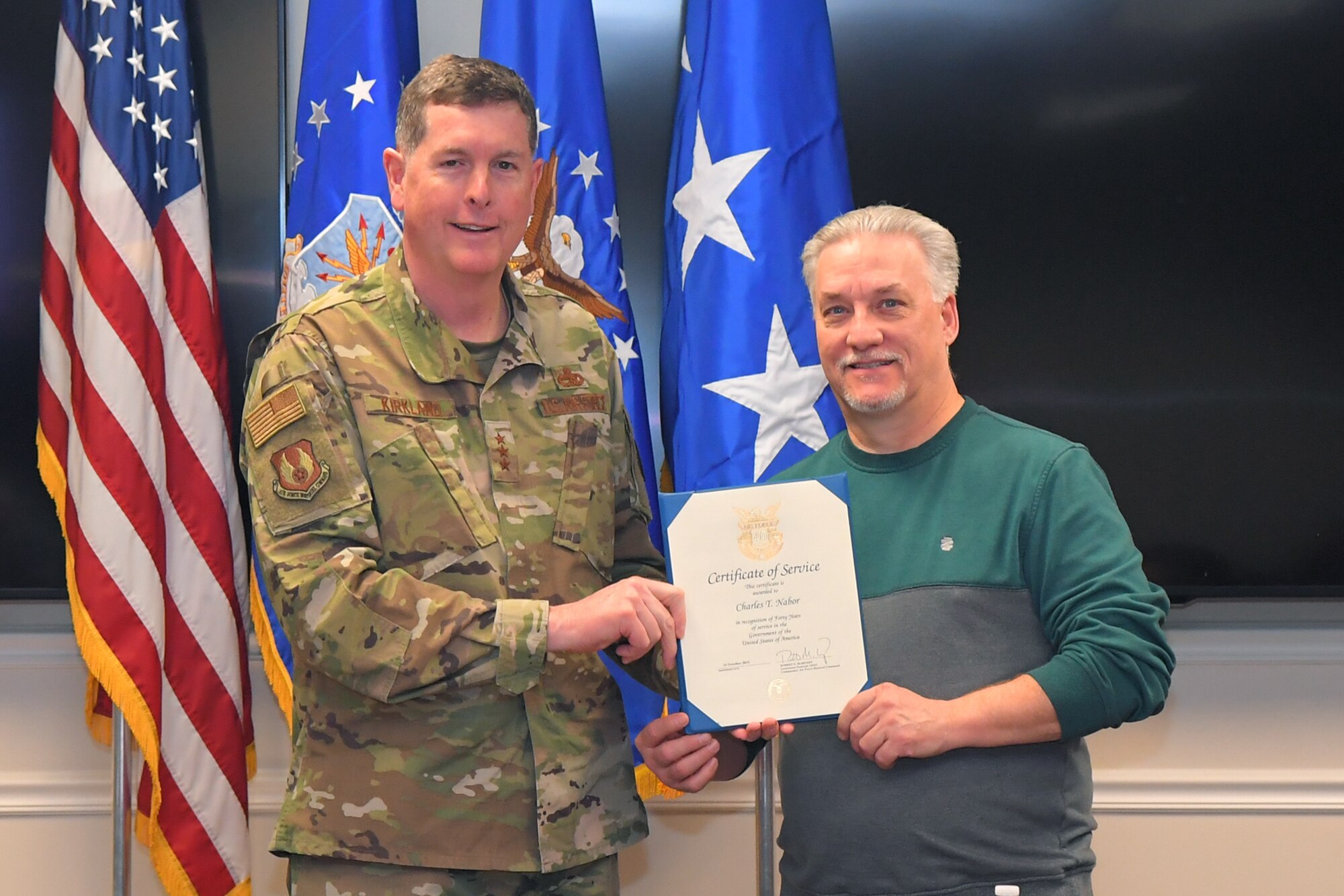 Charles T. Nabor, 524th Electronic Maintenance Squadron, receives a 40-year certificate of service from Lt. Gen Gene Kirkland, Air Force Sustainment Center commander, Feb. 4, 2019, at Hill Air Force Base, Utah. (U.S. Air Force photo by Todd Cromar)