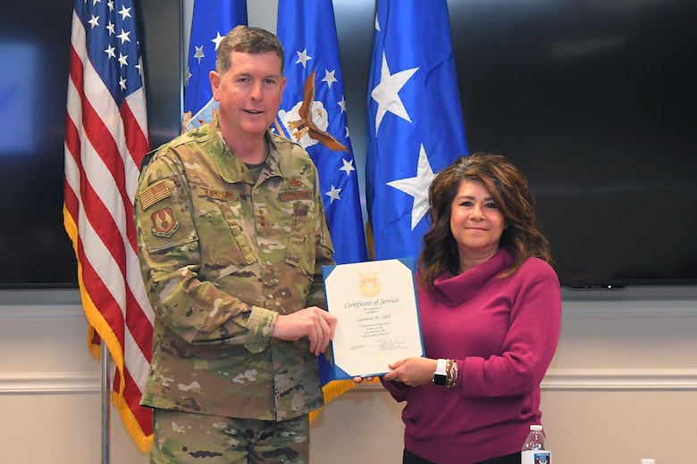 Lauriann M O’dell, Ogden Air Logistics Complex Business Office, receives a 40-year certificate of service from Lt. Gen Gene Kirkland, Air Force Sustainment Center commander, Feb. 4, 2019, at Hill Air Force Base, Utah. (U.S. Air Force photo by Todd Cromar)