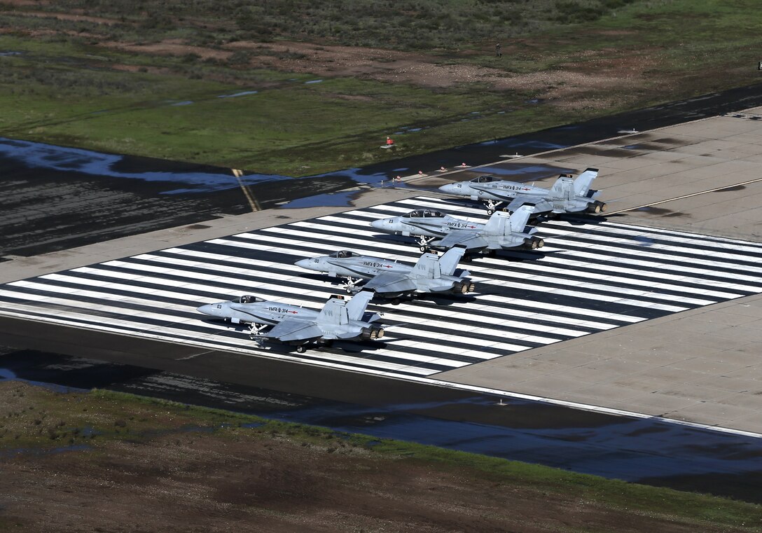 Four F/A-18 Hornets with Marine Fighter Attack Squadron (VMFA) 314, Marine Aircraft Group (MAG) 11, stage during a MAG-11 training exercise that included more than 30 aircraft at Marine Corps Air Station Miramar, Calif., Feb. 1.  MAG-11 conducted this training to exercise its real-world capabilities.  Exercises such as this provide realistic, relevant training necessary for 3rd MAW to “Fix, Fly, and Fight” as the Marine Corps’ largest aircraft wing and ensures the unit remains combat-ready, inter-operable, deployable on short notice, and lethal when called into action.  (U.S. Marine Corps photo by Cpl. Mark A. Lowe II)