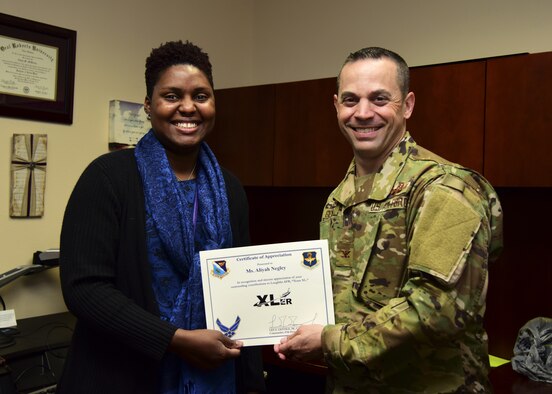 Aliyah Negley, 47th Flying Training Wing community support coordinator, was chosen by wing leadership to be the “XLer of the Week”, for the week of Feb. 7, 2019, at Laughlin Air Force Base, Texas. The “XLer” award, presented by Col. Lee Gentile, 47th FTW commander, is given to those who consistently make outstanding contributions to their unit and the Laughlin mission. (U.S. Air Force photo by Airman 1st Class Anne McCready)