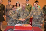 Maj. Gen. Barbara Holcomb, chief of the U.S. Army Nurse Corps, and the youngest Army nurse in attendance, 2nd Lt. Jennifer Garcia, cut the cake to celebrate the 116th birthday of the Army Nurse Corps Feb. 2 during a ceremony in the Brooke Army Medical Center auditorium.