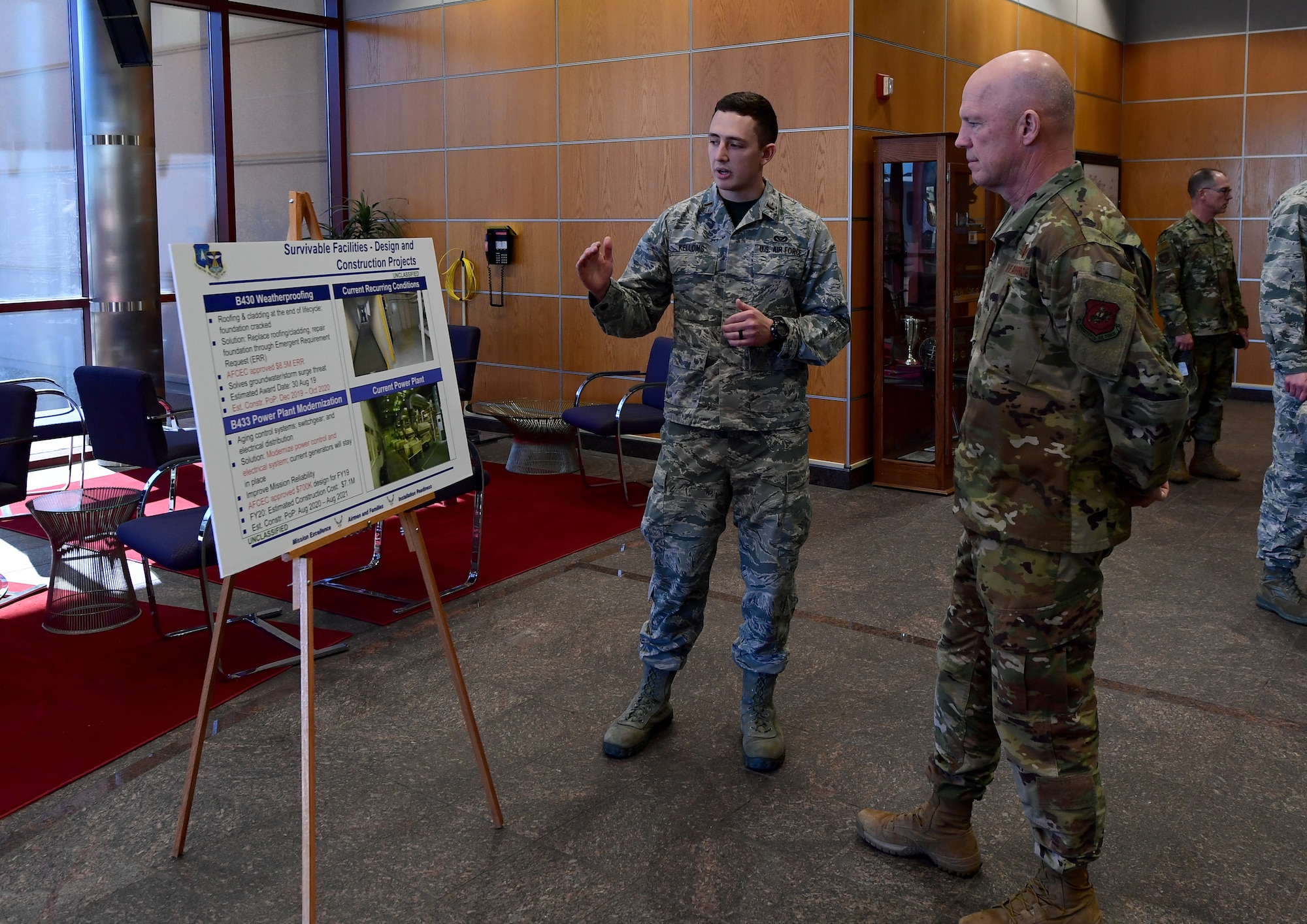 Gen. Jay Raymond, Air Force Space Command commander, receives a brief from 2nd Lt. Zachary Evans, 460th Civil Engineer Squadron about weather proofing and future construction projects to improve mission reliability at Buckley Air Force Base, Colorado, Feb. 1, 2019. (U.S. Air Force photo by Senior Airman Jazmin Smith)