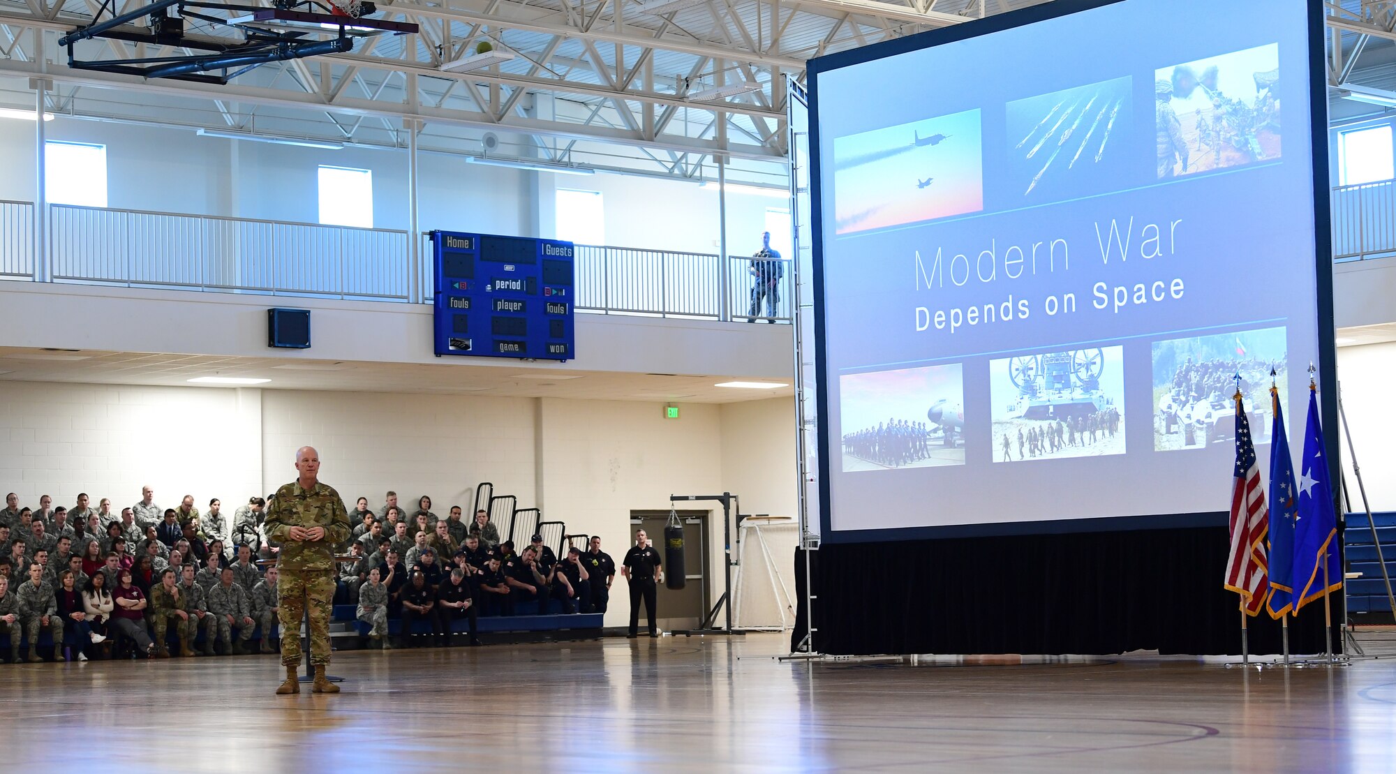 Gen. Jay Raymond, Air Force Space Command commander, speaks to members of Team Buckley about the importance of a warrior culture for those who protect the space domain and deter adversaries during an all call at Buckley Air Force Base, Colorado, Feb. 1, 2019. (U.S. Air Force photo by Senior Airman Jazmin Smith)