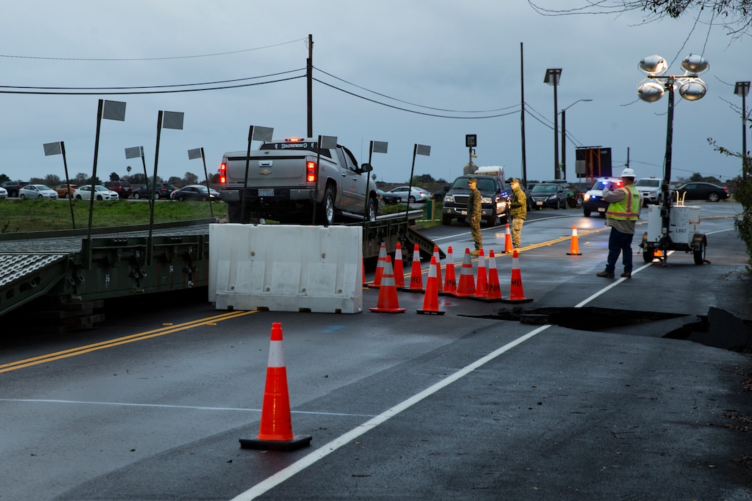 An emergency vehicle crosses a medium girder bridge on Carnes Road at Marine Corps Base Camp Pendleton, Feb. 5, 2019. The bridge was built to give emergency vehicles the ability to traverse a sinkhole that had developed in the road the due to erosion. (U.S. Marine Corps photo by Cpl. Dylan Chagnon)