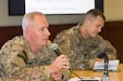 U.S. Army Col. Rick Hoerner, commandant of the Financial Management School and Chief of the Finance Corps, answers questions during a panel discussion of senior finance and comptroller leaders during the U.S. Army Central Financial Management and Comptroller Forum at Al Udeid Air Base, Qatar, Dec. 4, 2018. He discussed financial management force optimization, training doctrine, and enhancement of training opportunities.