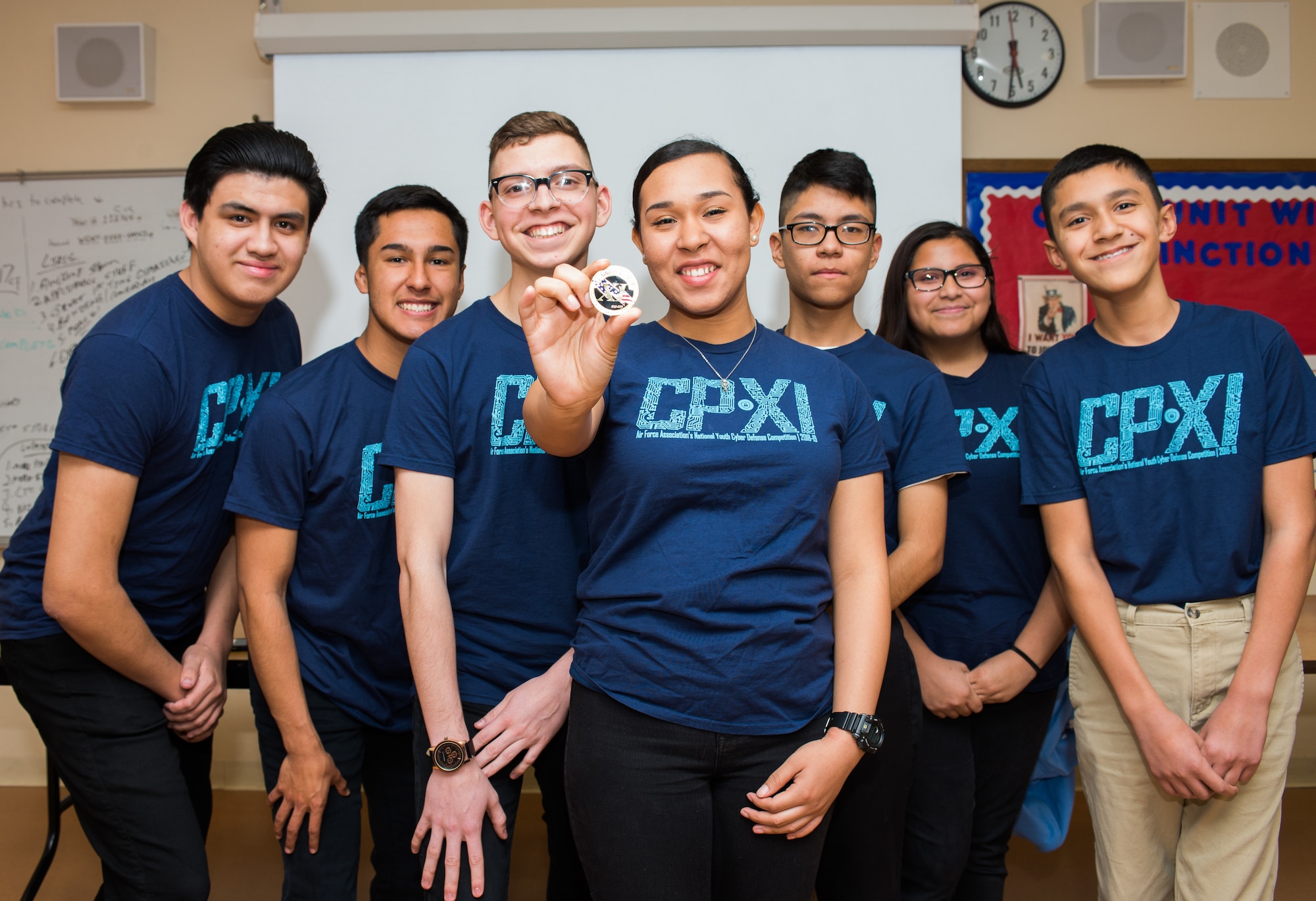 Thomas Jefferson High School’s Army Junior ROTC CyberPatriot team displays the CyberPatriot challenge coin during their CyberPatriot meeting in San Antonio, Texas, Jan. 31, 2019. Jefferson’s team advanced to the gold and platinum rounds of this year’s competition. (U.S. Air Force photo by Sharon Singleton)