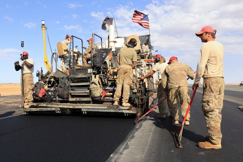 Airmen assigned to the 31st Expeditionary Red Horse Squadron, pave a flight line in Niger.