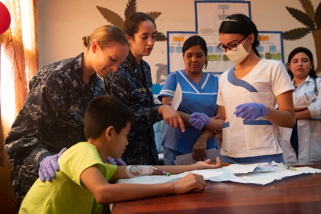 Nurse talks to group of people