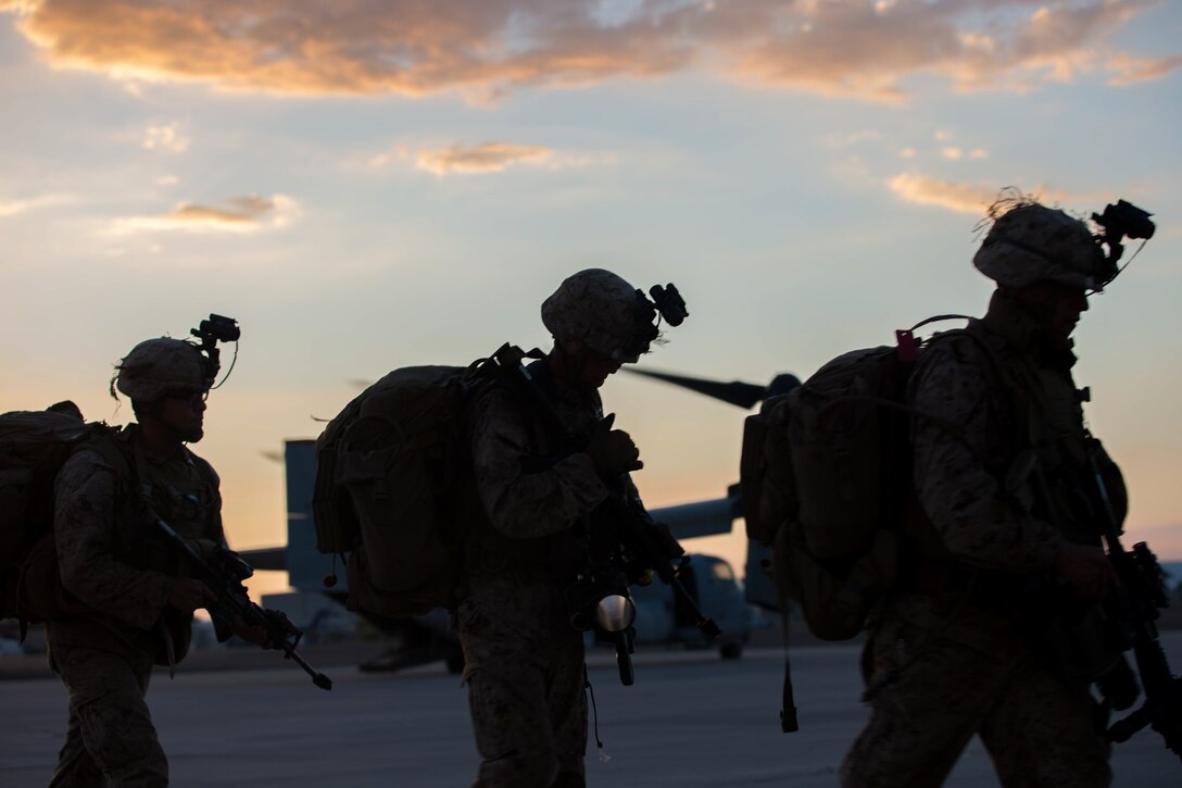 U.S. Marines with 2nd Battalion, 4th Marines walk to the MV-22 Osprey during Summer Fury at Naval Air Facility El Centro, Calif., Aug. 4, 2017.