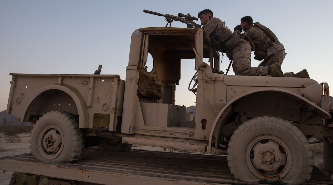 U.S. Marine Corps Cpl. Brandon Thein, right, and U.S. Marine Corps Lance Cpl. John Jennings with 2nd Battalion, 4th Marines sight into a weapon during Summer Fury at Yuma, Ariz., Aug. 5, 2017.