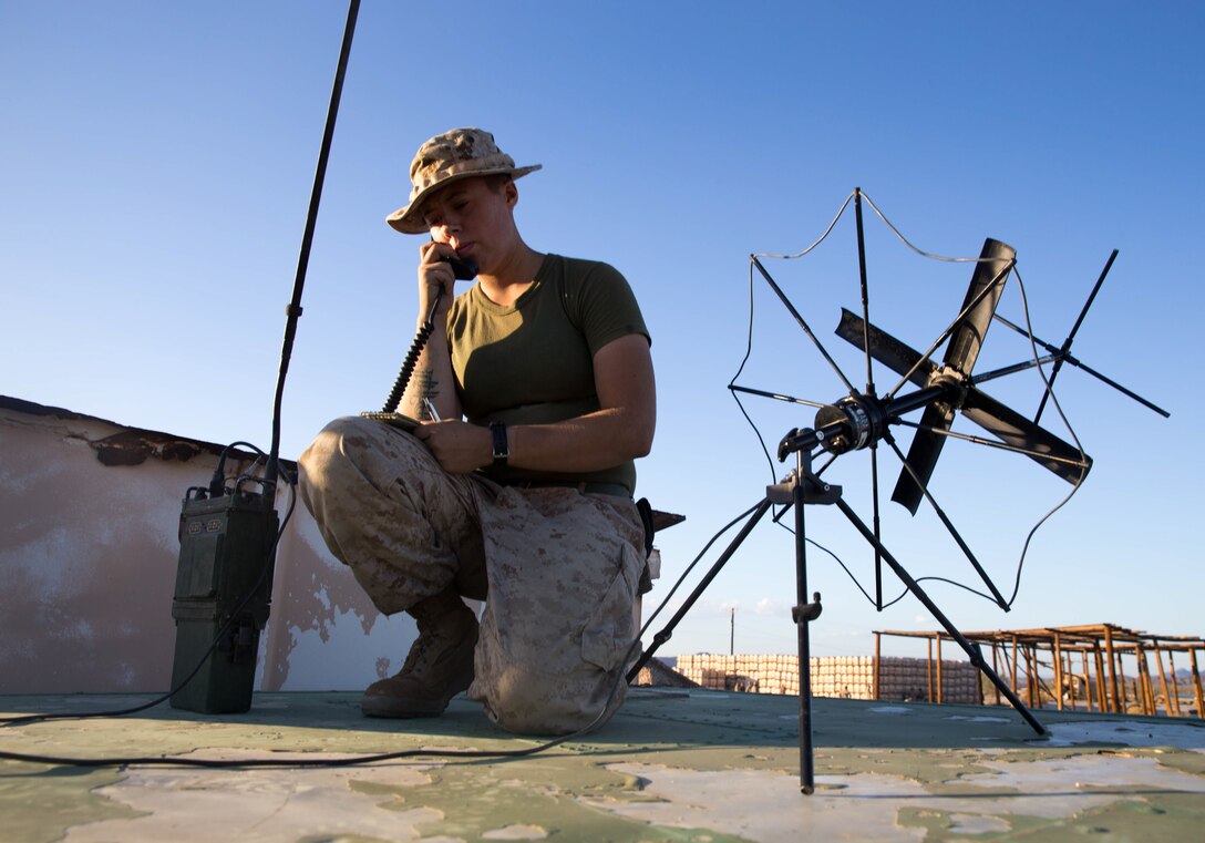 U.S. Marine Corps Cpl. Emylee Oko, 2nd Battalion, 4th Marines, transmits information during Summer Fury at Yuma, Ariz., Aug. 6, 2017.