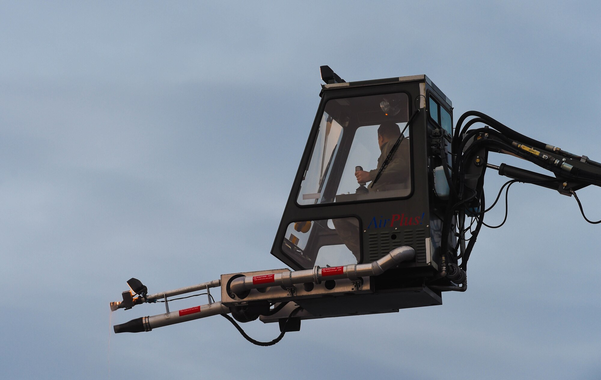 As the team begins deicing procedures, Tech. Sgt. Salomon Gutierrez, 62nd Aircraft Maintenance Squadron noncommissioned officer in charge of Silver Flight, controls the bucket of a deicing truck at Joint Base Lewis-McChord, Wash., Jan. 16, 2019. The bucket allows Airmen to move around and spray deicing liquid onto the wings and tails of an aircraft to remove ice and snow. (U.S. Air Force photo by Senior Airman Tryphena Mayhugh)