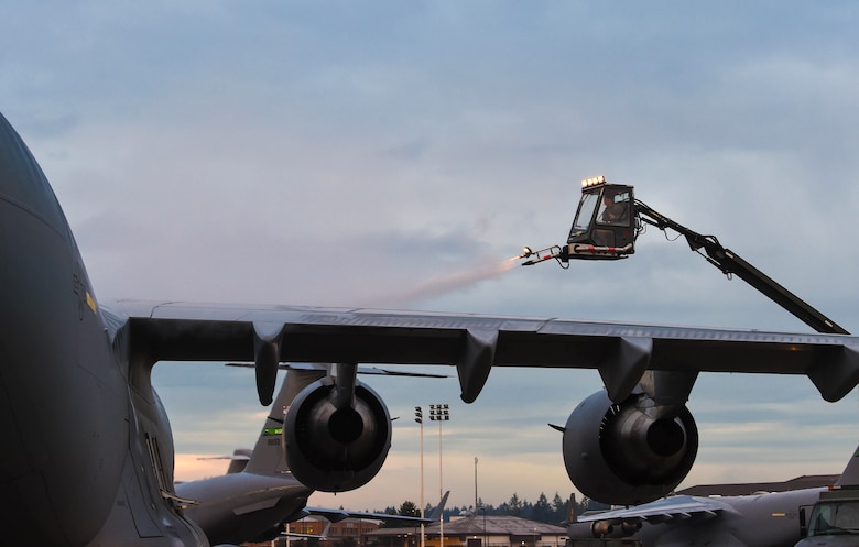 In order to make the aircraft safe to fly, Tech. Sgt. Salomon Gutierrez, 62nd Aircraft Maintenance Squadron noncommissioned officer in charge of Silver Flight, sprays deicing liquid onto a C-17 Globemaster III at Joint Base Lewis-McChord, Wash., Jan. 16, 2019. The deicing liquid prevents ice and snow from interfering with flight control surfaces such as the tail and wings. (U.S. Air Force photo by Senior Airman Tryphena Mayhugh)