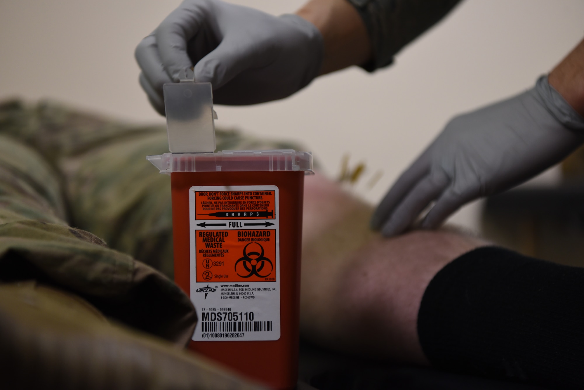 A needle is thrown away by Capt. Eric Walter, 90th Medical Operations Squadron physical therapy flight commander, after a dry needling procedure on a 890th Missile Security Forces Squadron defender during a weekly squadron visit Feb. 4, 2019, at F.E. Warren Air Force Base, Wyo. Procedures such as dry needling and battlefield acupuncture are available to 890th MSFS defenders weekly during 90th MDOS PT visits. The weekly program is designed for defenders who are unable to attend appointments due to the unusual schedule and the physical therapy team plans to open up appointments to the remaining Missile Security Forces Squadrons in the coming months. (U.S. Air Force photo by Senior Airman Abbigayle Williams)
