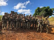 U.S. Marines Lt. Col. Warren C. Cook, Commanding Officer and SgtMaj Jose H. Molina, Sergeant Major for 2nd Battalion 4th Marines take a photo with Weapons Platoon while visiting Company F at Shoal Water Bay Training Area during Diamond Strike on May 30, 2018.