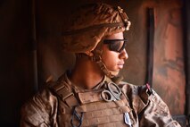 HM3 Deshawn Stokes, Navy Corpsman with 2nd Battalion, 4th Marine Regiment, rides in the back of a vehicle during Humvee live-fire of mounted 50 caliber, Mark 219 and 7.62 automatic weapons with Combined Anti-Armor Team 2 Aug. 22, 2018, during Marine Rotational Force – Darwin’s Exercise Koolendong at Mount Bundey Training Area, Australia.