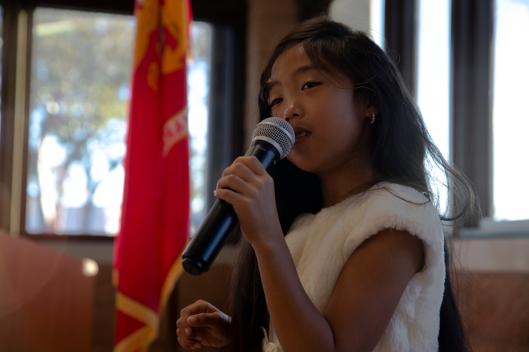 Joylani Nicolas, a singer with the Marine Corps Air Station Miramar chapel, performs during the National Prayer Breakfast at MCAS Miramar, Calif., Feb. 7. The National Prayer Breakfast is a yearly event that is designed to be a forum for professionals in the political, social and business worlds to assemble and build relationships. (U.S. Marine Corps photo by Cpl. Preston Hightower)