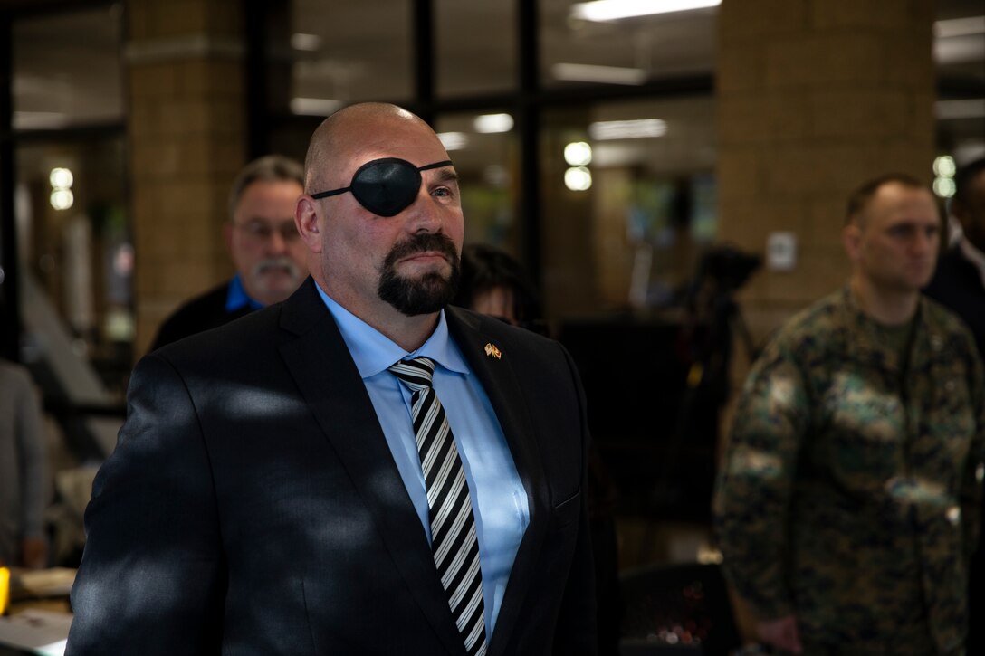 Ret. GySgt. Nicholas Popaditch, former Marine and motivational speaker, stands for the Marine Corps hymn during the National Prayer Breakfast Feb. 7, 2018 at Marine Corps Air Station Miramar. The National Prayer Breakfast is a yearly event that is designed to be a forum for professionals in the political, social and business worlds to assemble and build relationships. (U.S. Marine Corps photo by Cpl. Preston Hightower)